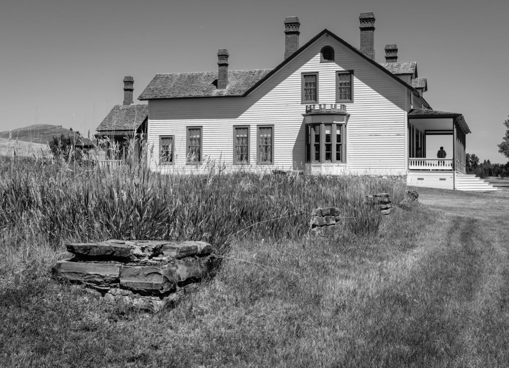 Old foundations line a field next to the home of General George Custer at Fort Lincoln, Bismarck, North Dakota in black white