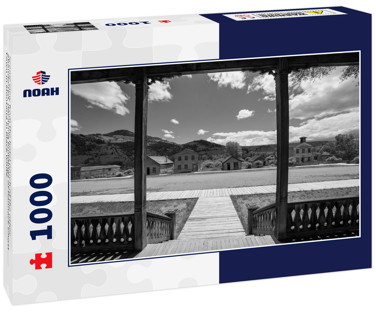 Scenic view from the hotel porch of the other abandoned, decaying buildings of Bannack Ghost Town in Montana in black white