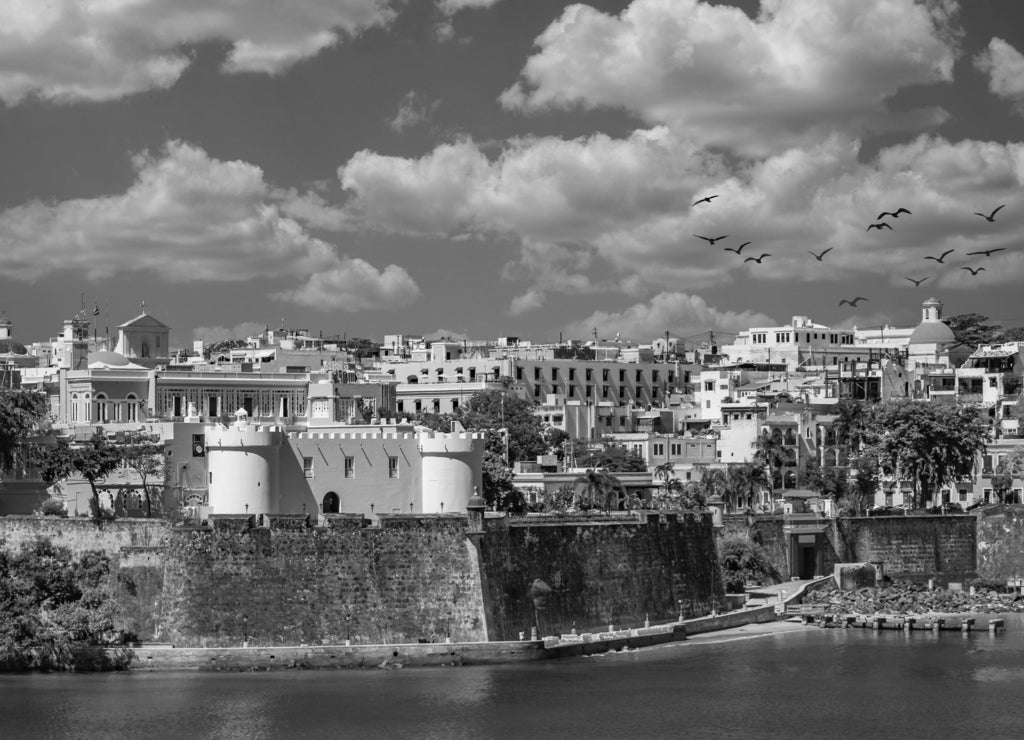 Colorful, historical buildings on the coast of Old San Juan, Puerto Rico in black white