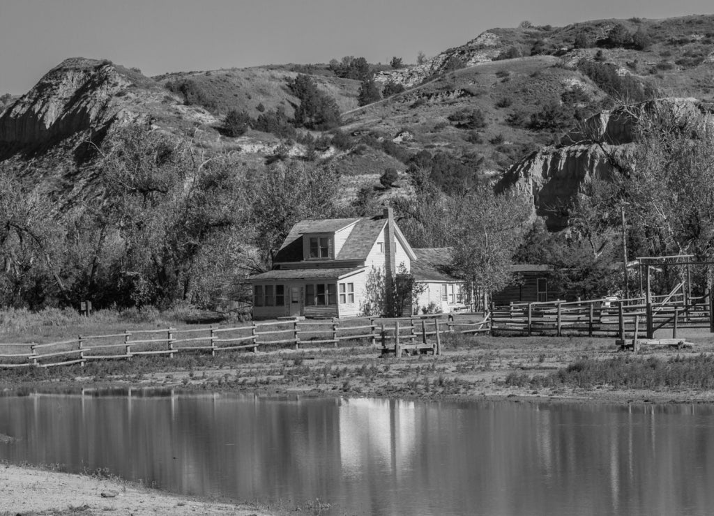 Ranch house and pond in Teddy Rosevelt National Park, North Dakota in black white