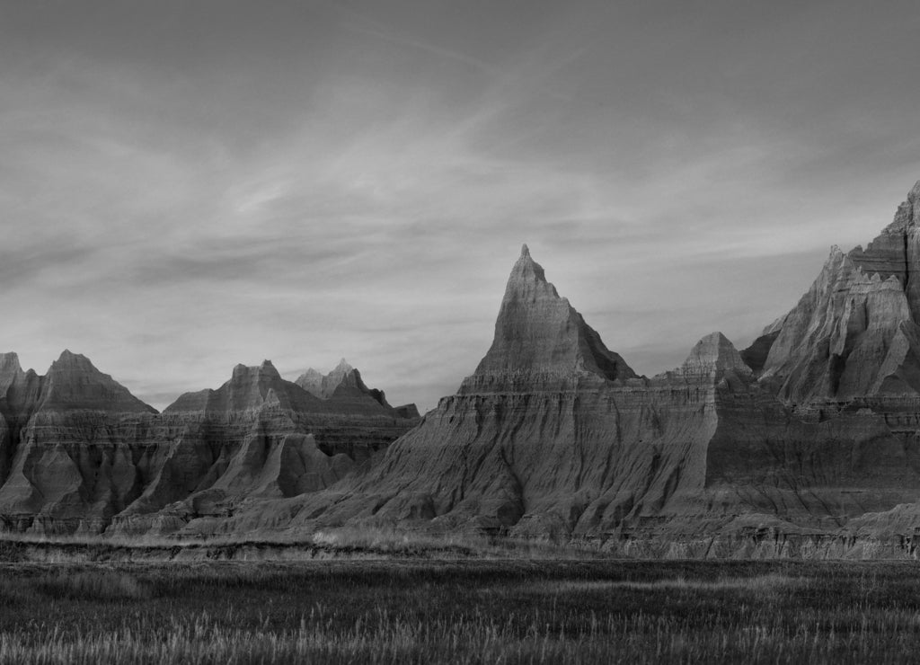 Panorama of Eroded Mountains of Badlands National Park, South Dakota, During a Pink Sunset in black white