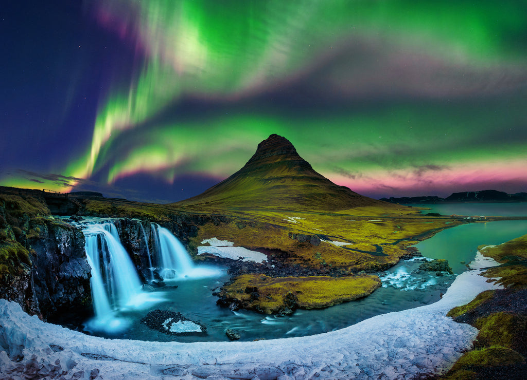 Northern lights, in Kirkjufell in Iceland with waterfalls