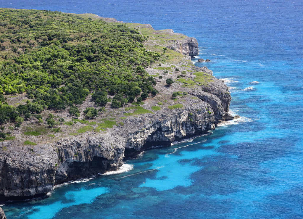 Aerial view of the Northern Mariana Islands and the calm sea on a sunny day