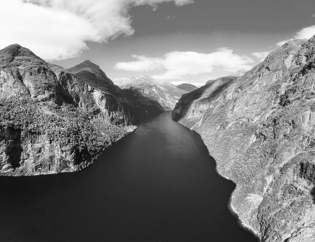 Noah Jigsaw Puzzle Medieval alley in the historic Hanseatic city of Visby, Sweden. In the background you can see the shooting tower of the ring wall of Visby, a UNESCO World Heritage Site in black white 1000 pieces