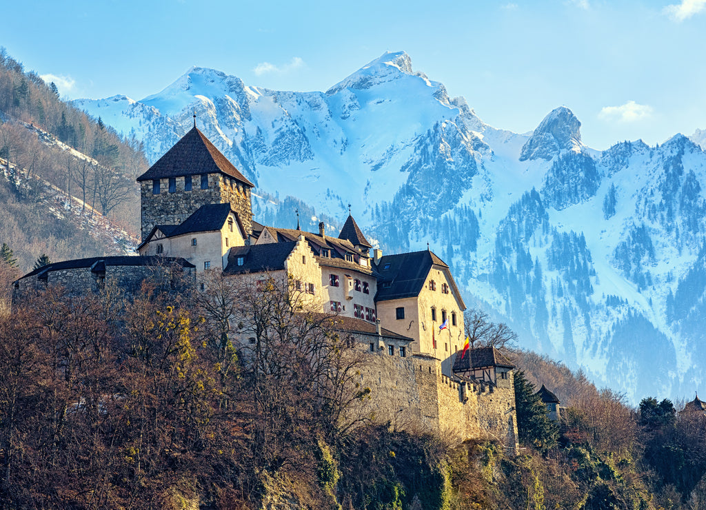 Vaduz Castle, Liechtenstein, with snow-capped alpine mountains in the background