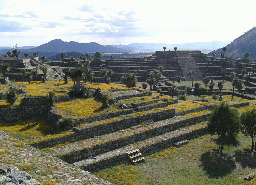 Pyramid and ancient ruins at Cantona against cloudy sky on sunny day, Mexico