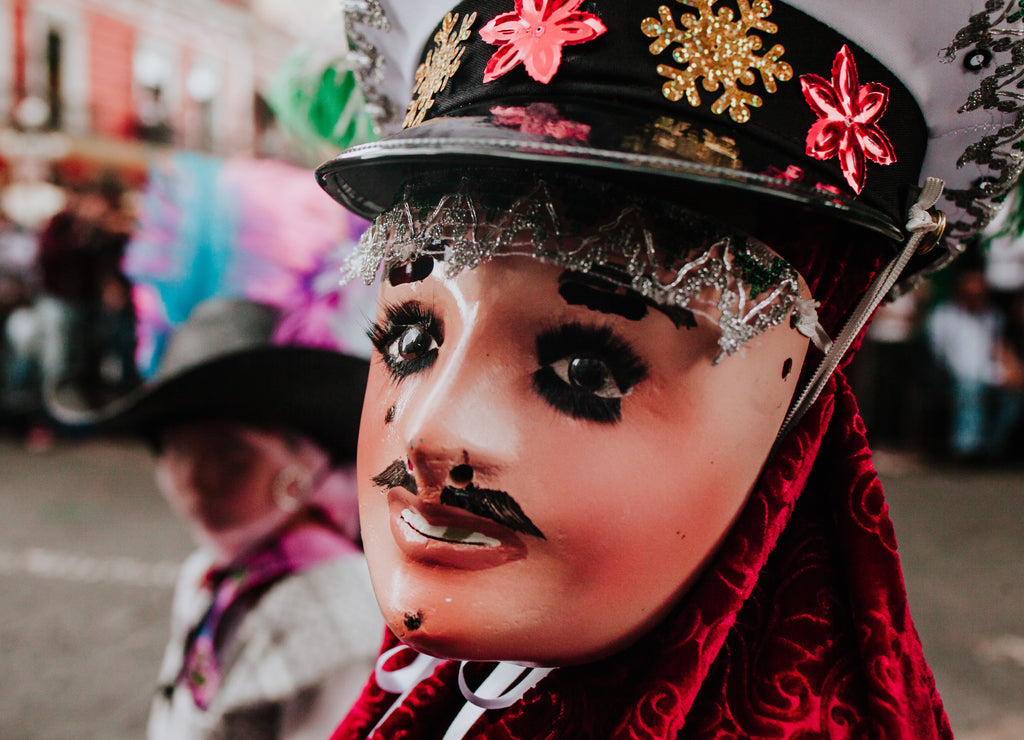 Huehues Mexico, Mexican carnival scene, dancer wearing a traditional Mexican folk costume and colorful mask