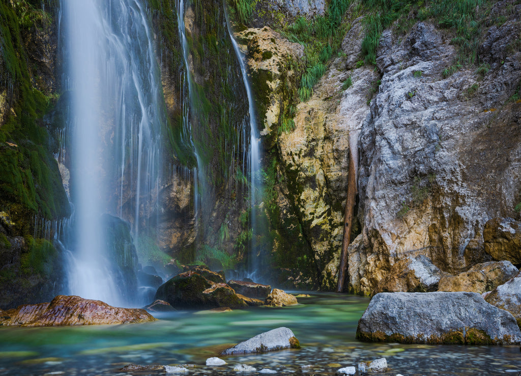 Grunas waterfall 2 km behind the village of Theth in Albania. Theth is a small village in Shkodër county in Albania. It is a protected landscape area