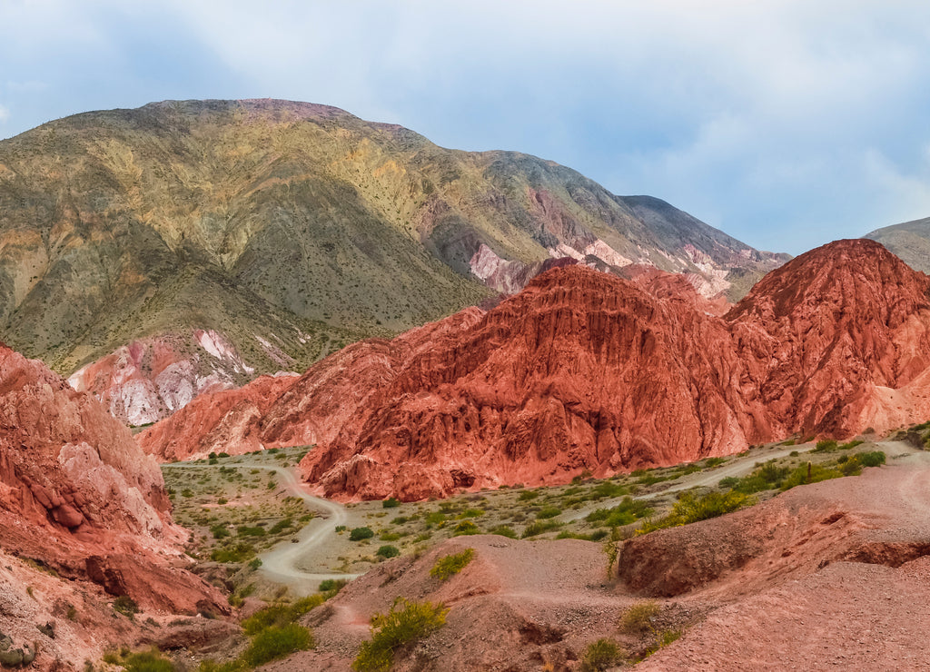 Panoramic stock photo of the colored hills and mountains in Purmamarca village , Jujuy, Argentina. Landscape