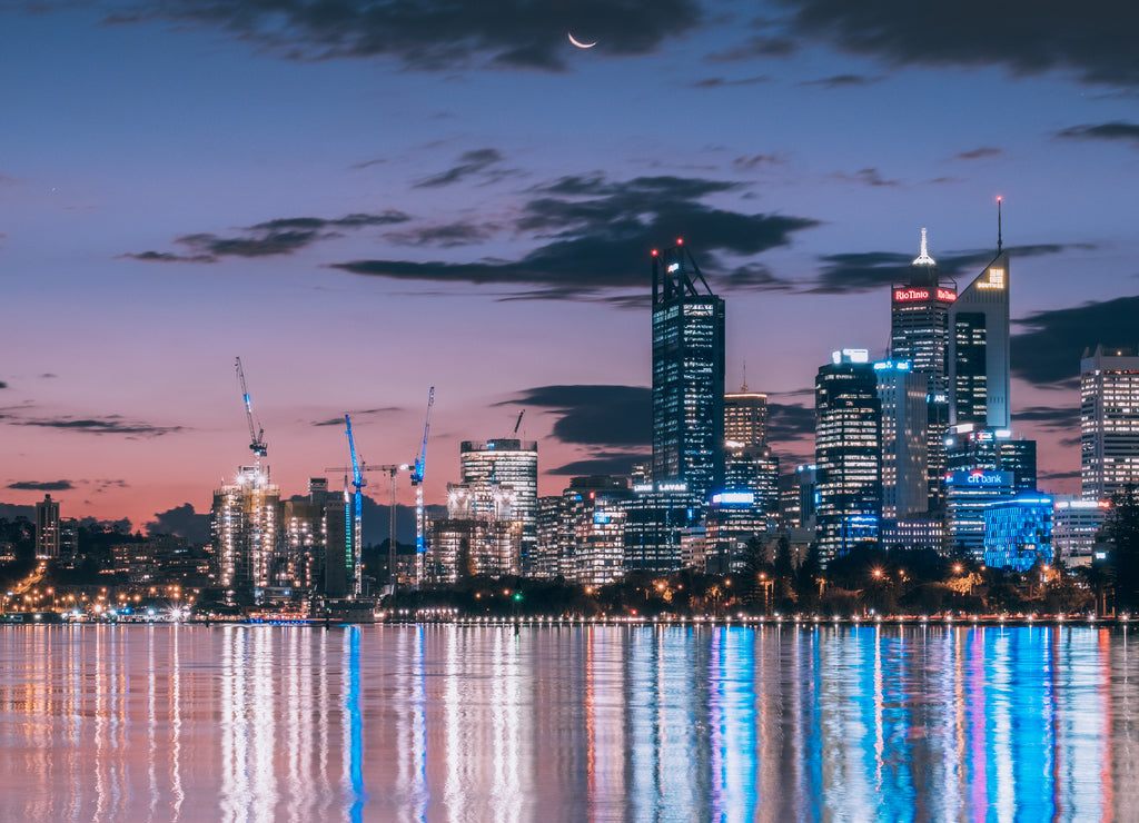City light with sunset and moon rise together at Perth city