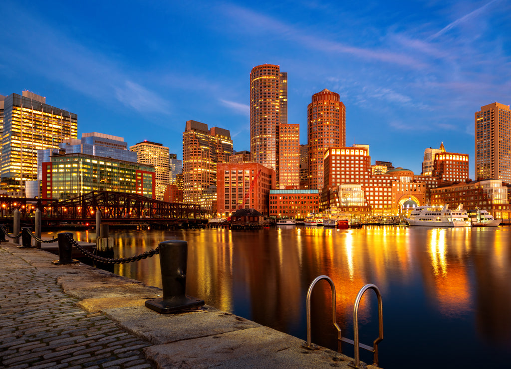 Boston harbor with cityscape and skyline on sunset