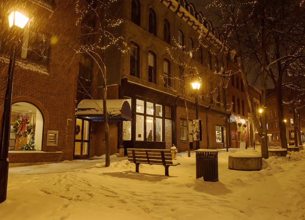 The streets of the night winter city during a snowfall. Portland. USA. Maine