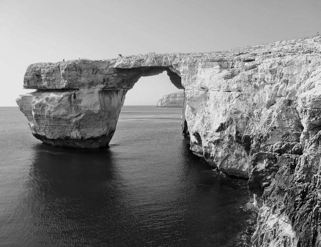 Noah Jigsaw Puzzle Deerfield Beach Water Tower Identifying Sign at Broward Sheriff and Fire Station Framed by Two Palm Trees, a Sidewalk and the Street in a Sunny Day in January in black white 1000 pieces