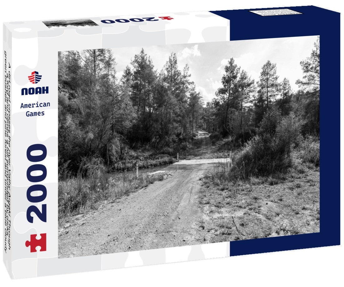 Noah Jigsaw Puzzle A dirt road crosses the river Vathy Argaki Through a ford and climbs a hill surrounded by rocks, green bushes and pine forest and under a blue cloudy sky (Kornos, Larnaca District, Cyprus) in black white 2000 pieces
