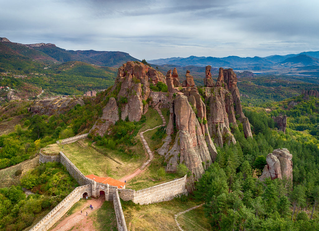 Aerial shot of Beautiful landscape with bizarre rock formations. Stone stairs leading to the amazing rock formations and walls of a medieval fortress in Belogradchik, northwest Bulgaria