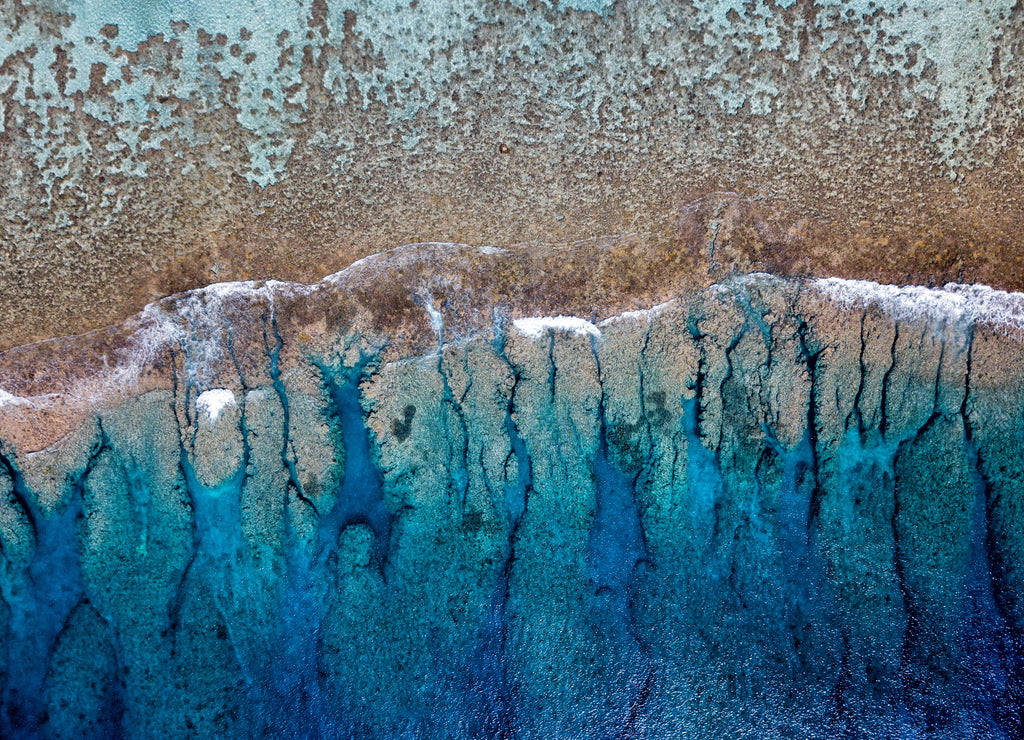 Aerial view of waves on reef of polynesia Cook islands