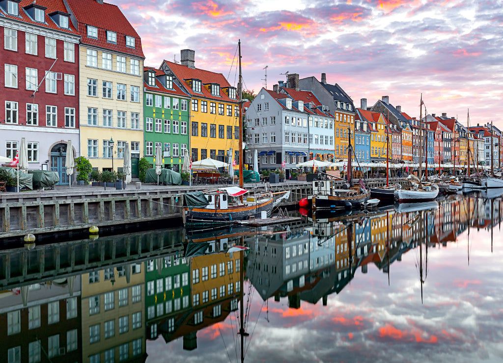 Copenhagen. Nyhavn Canal, colorful houses and city embankment at sunrise