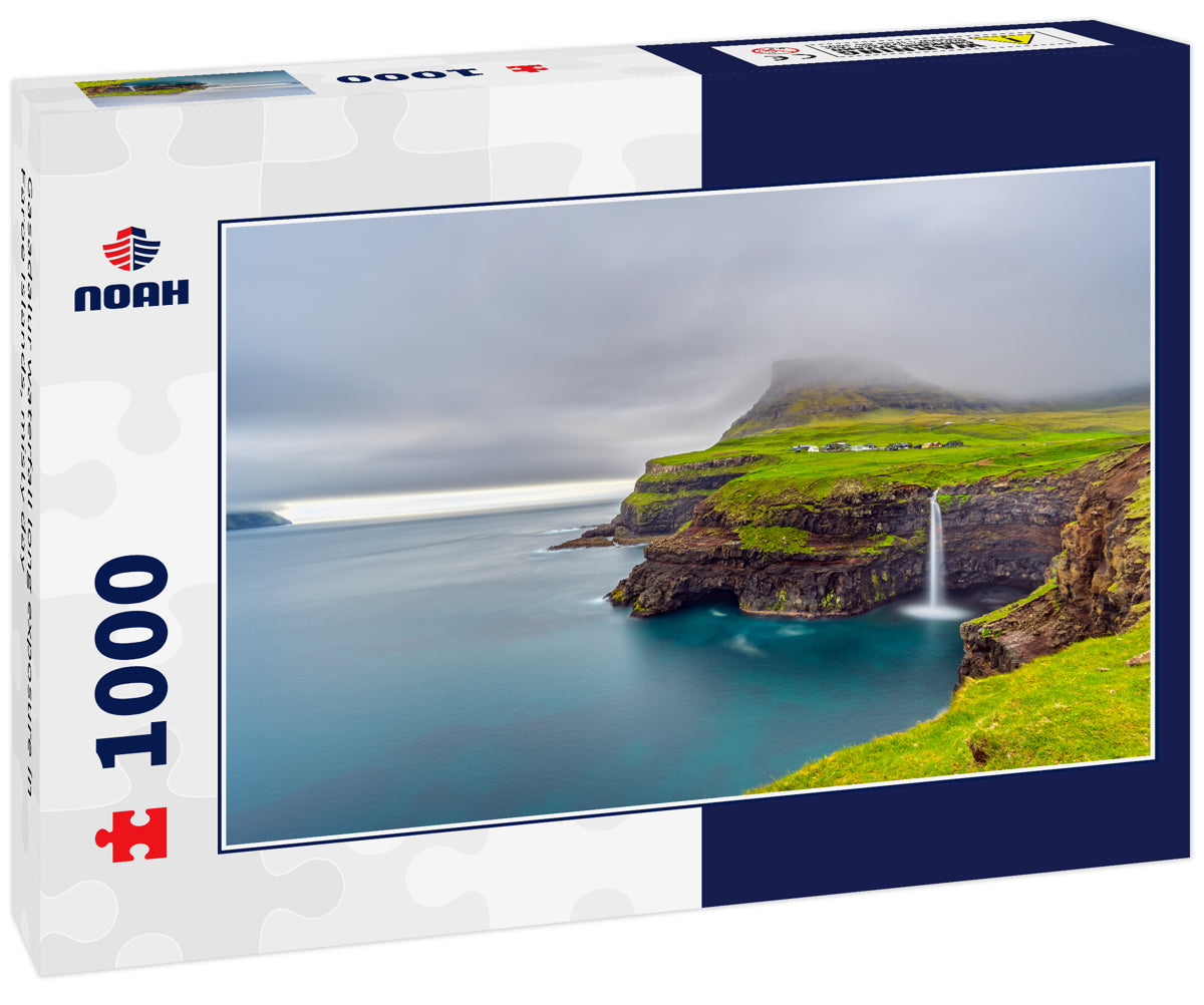 Gasadalur waterfall long exposure in Faroe Islands, misty day