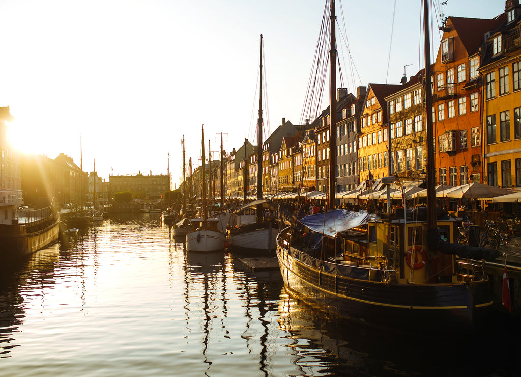 Ships at sunset. Picturesque architecture in the Old Town of Copenhagen, Denmark