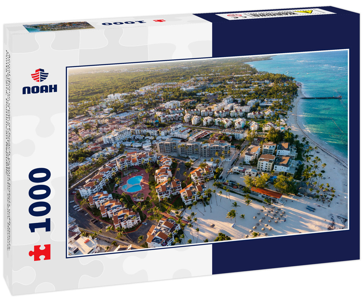 Aerial drone view of beach resort hotels with pools, umbrellas and blue water of Atlantic Ocean, Bavaro, Punta Cana, Dominican Republic