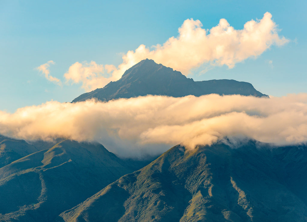 The high altitude Andes mountain peak of the Cotacachi volcano at sunset near Otavalo and north of Quito, Ecuador