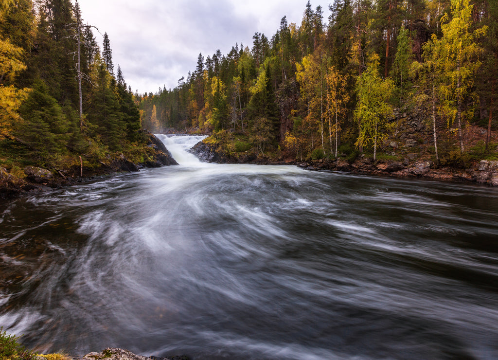Beautiful river with waterfall in the autumn forest, Oulanka national park, Finland