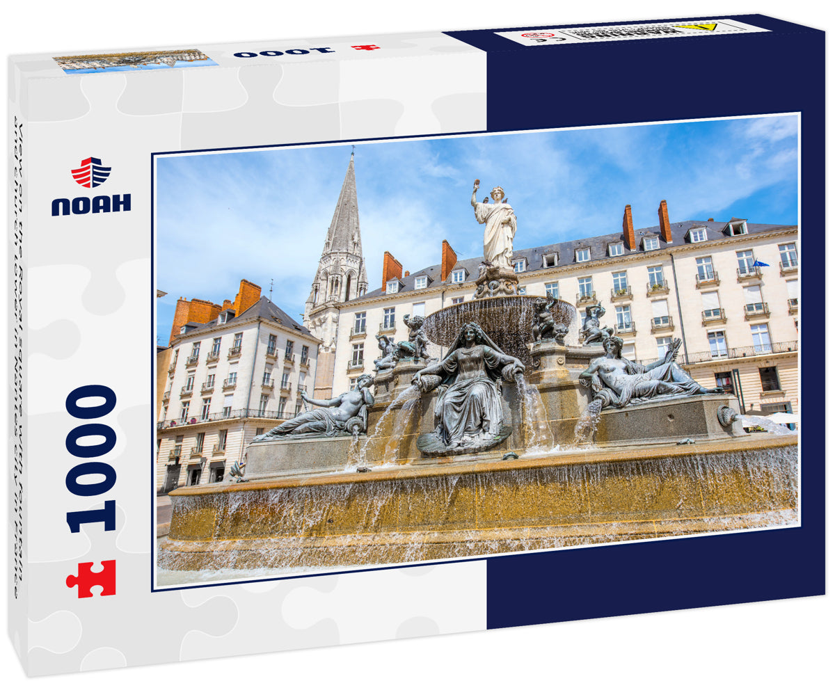 View on the Royal square with fountain and church tower in Nantes city in France