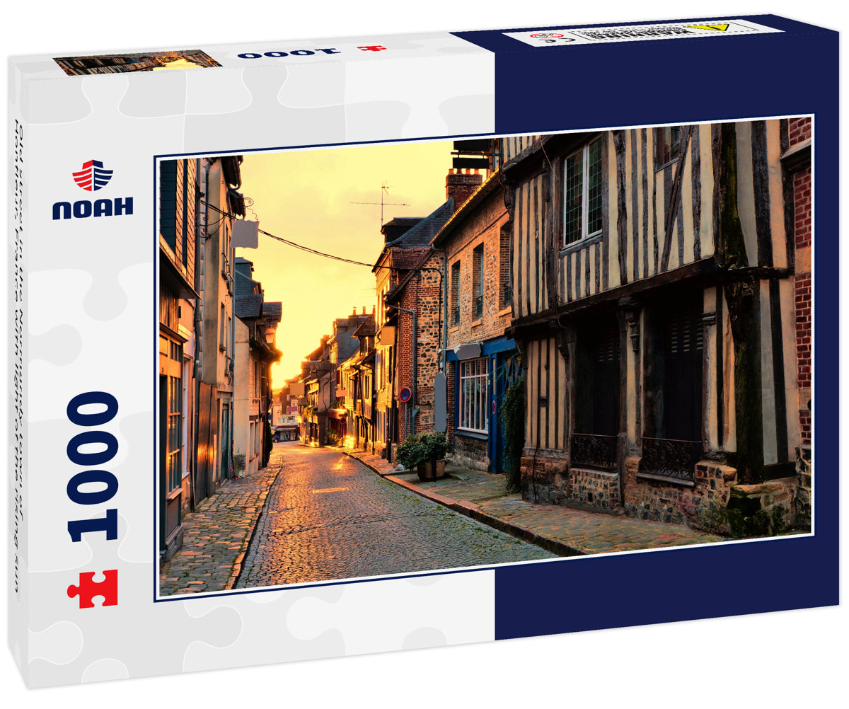 Old street in the Normandy town of Honfleur, France with light of the rising sun