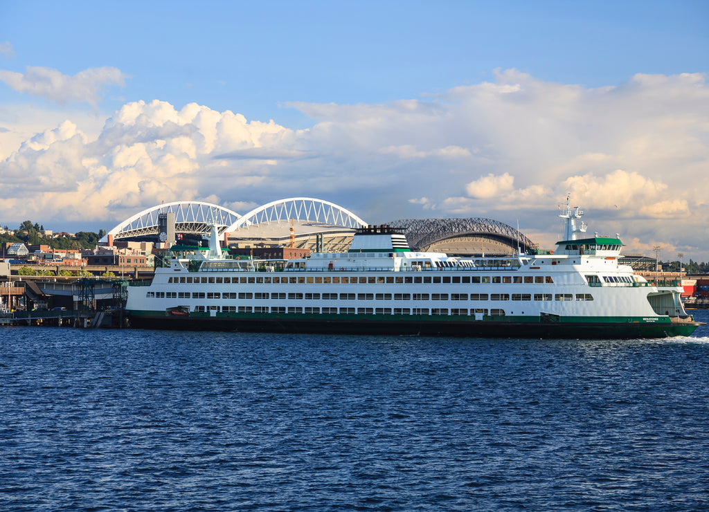 Washington State ferry 'Wenatchee' at ferry dock just south of downtown Seattle. Century Link Field and Safeco Field in background