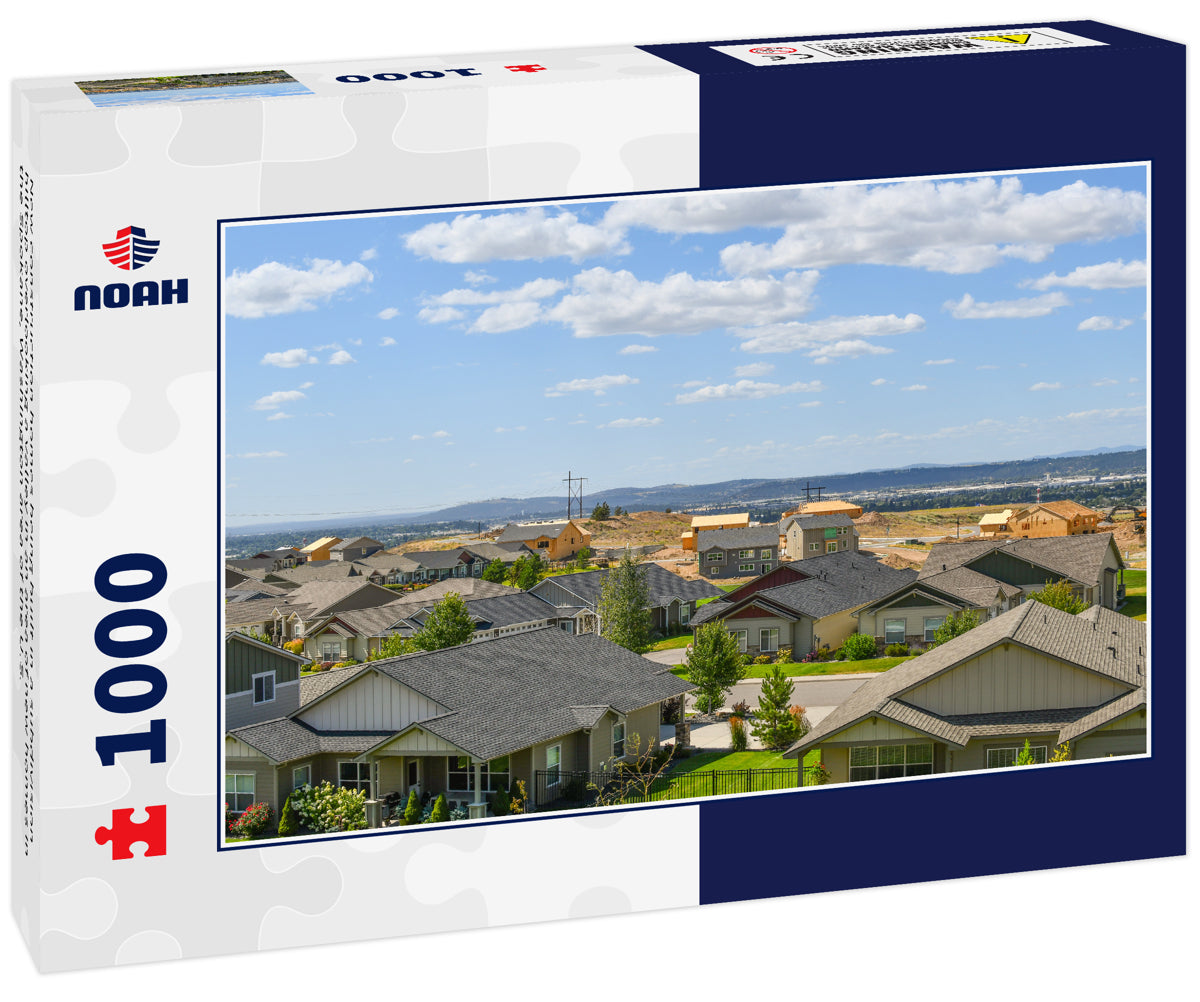 New construction homes being built in a subdivision hilltop overlooking a valley in an area of new homes in the Spokane, Washington area of the U.S.