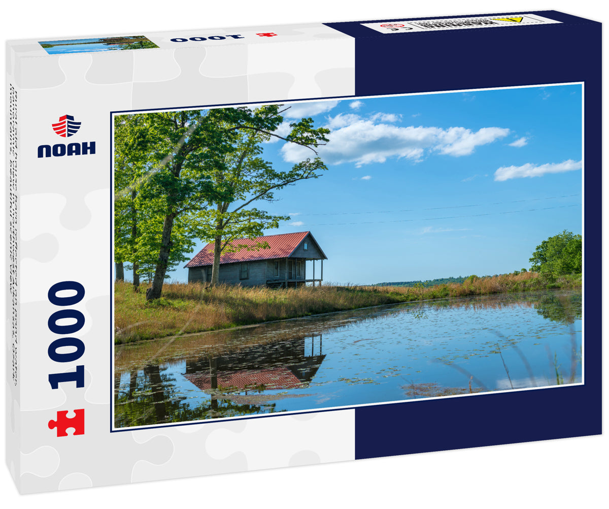 Rural old house barn reflected on pond water, panoramic view in northwest Arkansas, Ozark mountains, beautiful scenic view