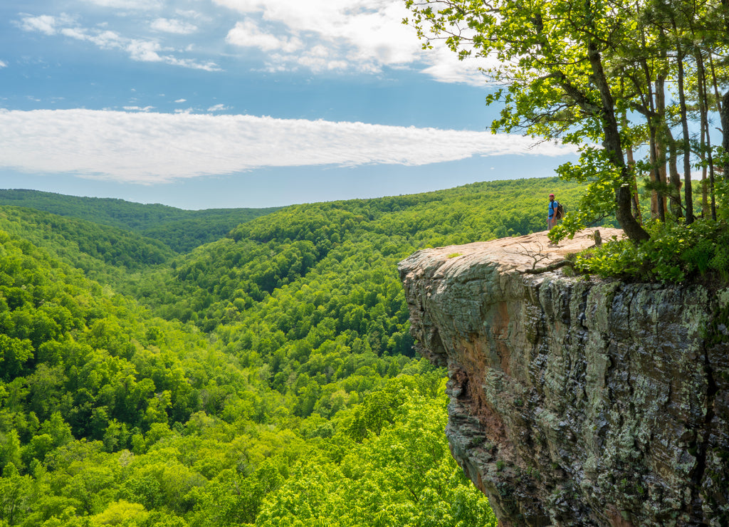 Tourist visitors couple taking pictures at Whitaker Point rock cliff hiking trail, landscape view, Ozark mountains, Northwest Arkansas