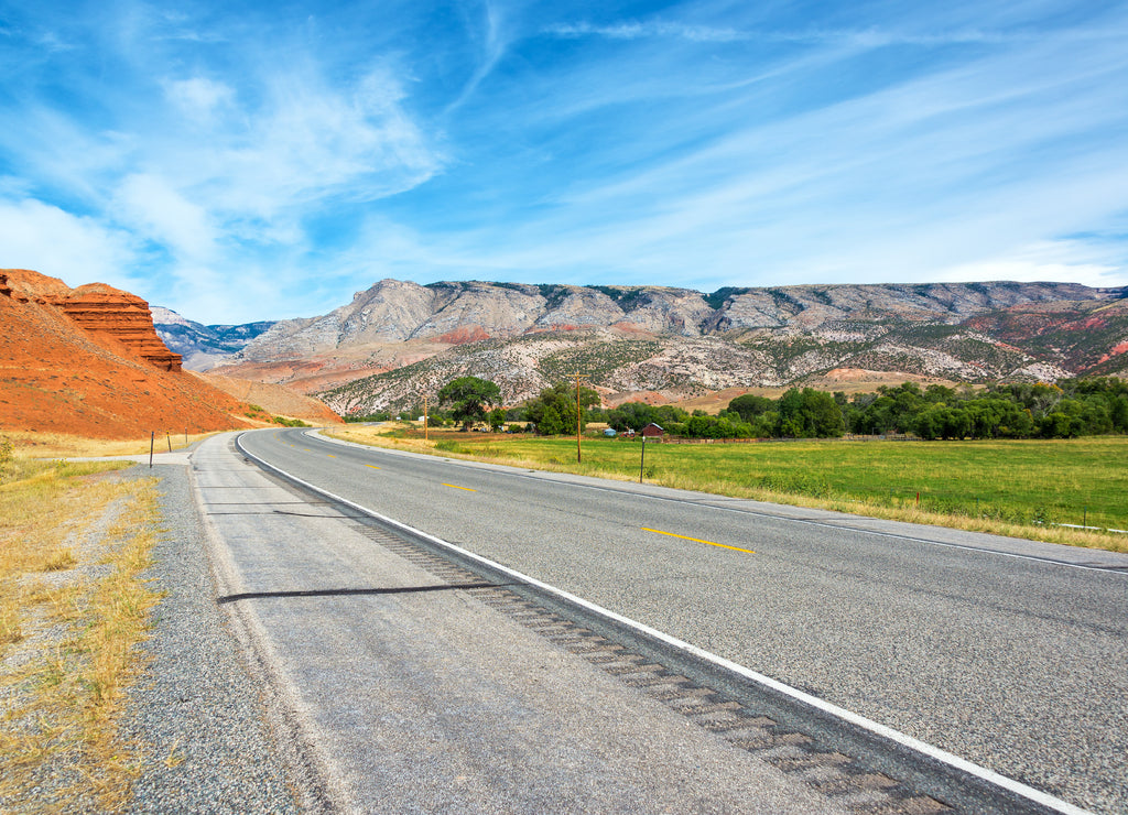 Highway passing through a colorful landscape in Shell, Wyoming