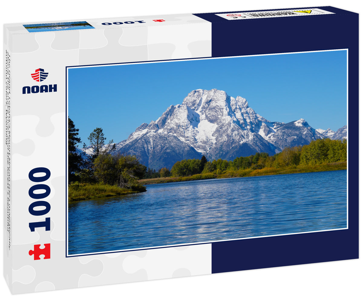 The Grand Tetons's Mount Moran rises majestically above the snake river and the forest's beautiful autumn colors, Wyoming