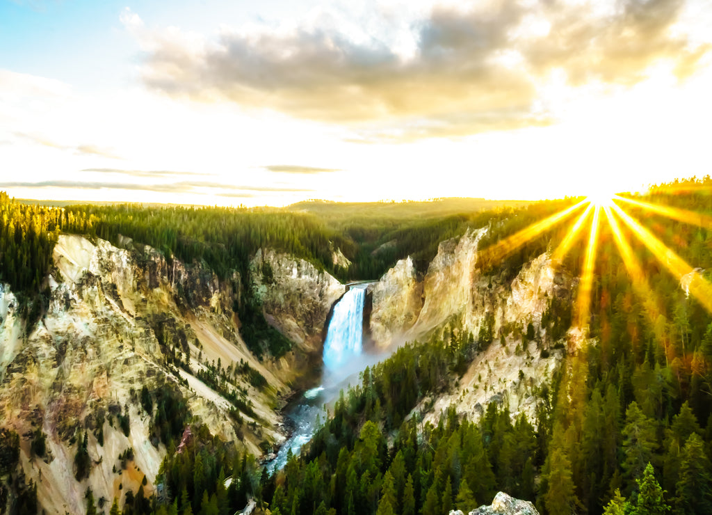 The Upper Falls of the Yellowstone River as the river flows through the yellow and orange sandstone cliffs in the Grand Canyon of the Yellowstone, in Yellowstone National Park, Wyoming, USA