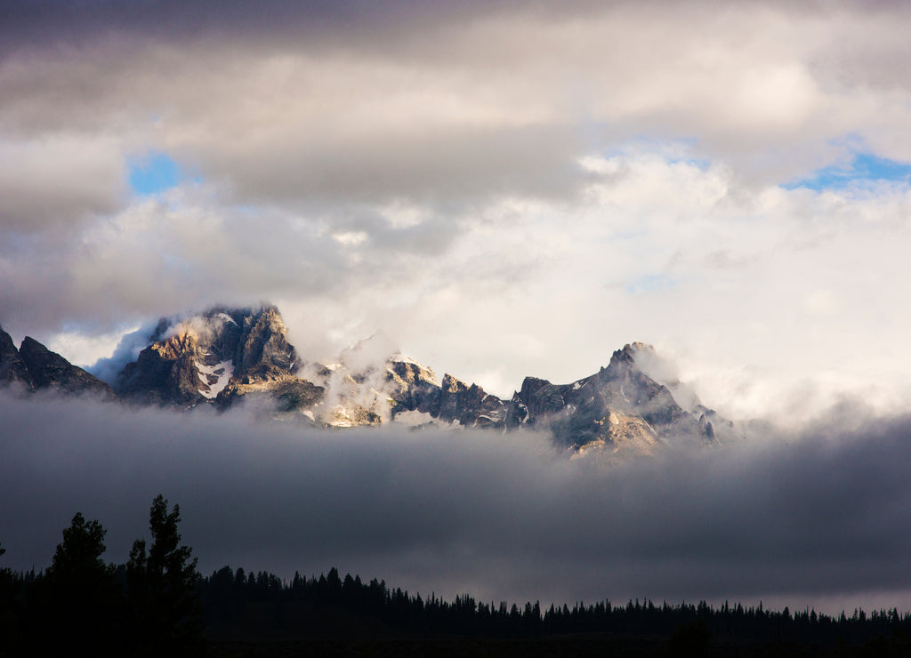Scenic view of clouds over mountains, Wyoming, USA