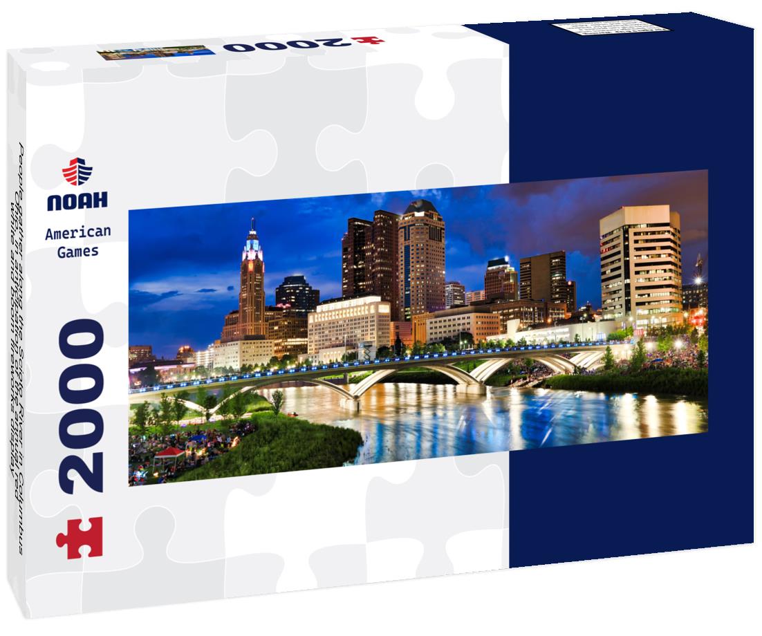 People gather along the Scioto River in Columbus, Ohio, in anticipation of the annual red, white and boom fireworks display 2000pc Panoramic Puzzle