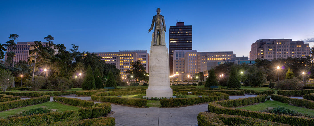 Statue and grave site of Huey Long on the grounds of the Louisiana State Capitol building at night in Baton Rouge, Louisiana 2000pc Panoramic Puzzle
