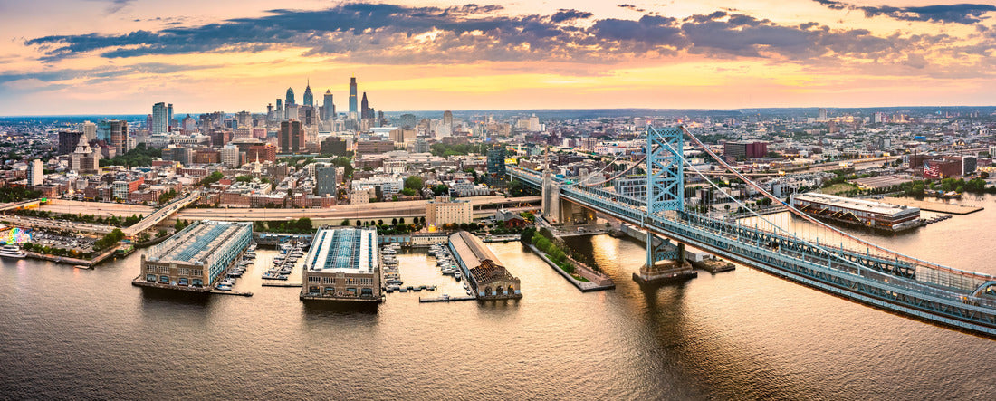 Aerial view with Ben Franklin Bridge and Philadelphia skyline at sunset. Ben Franklin Bridge is a suspension bridge between Philadelphia and Camden, NJ 2000pc Panoramic Puzzle