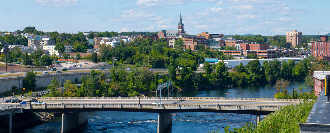 The historic skyline of Manchester, including Merrimack River, Granite Street Bridge and West Side Sainte Marie Parish Church in Manchester, New Hampshire NH, USA 2000pc Panoramic Puzzle
