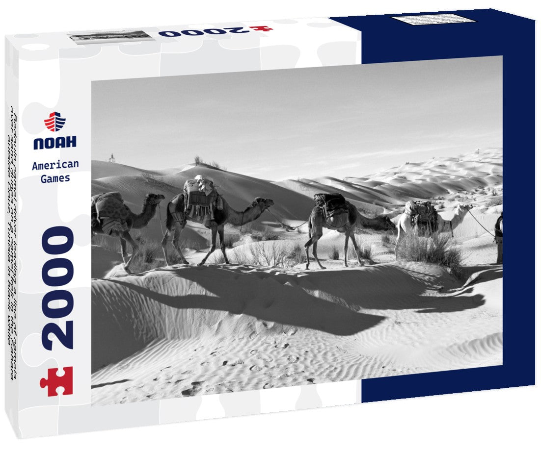 Noah Jigsaw Puzzle Bedouin camel driver leading a line of camels over sand dunes on a camel trek in the Sahara, outside Douz, Tunisia in black white 2000 pieces