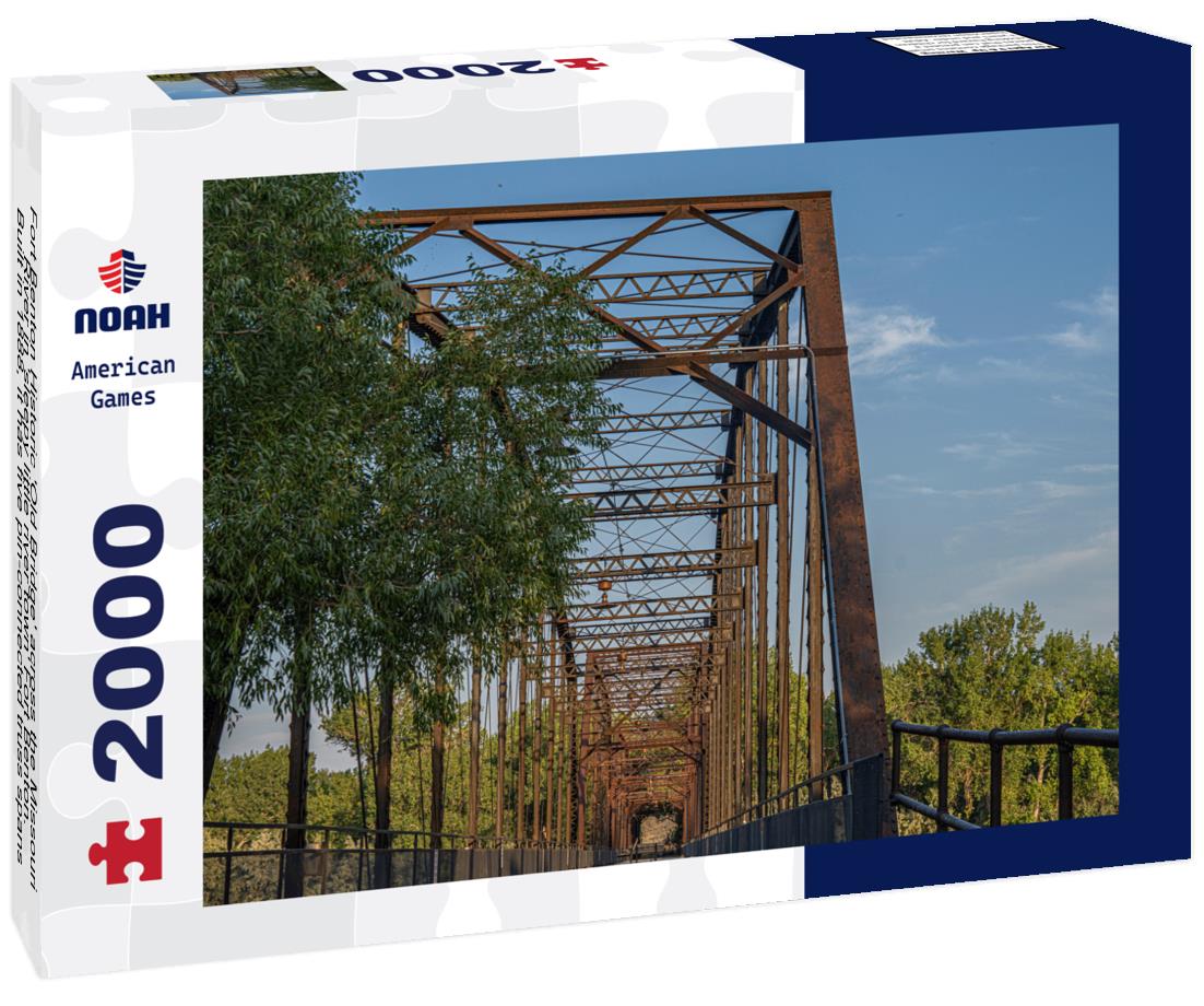 Noah Jigsaw Puzzle Fort Benton Historic 'Old Bridge' across the Missouri River in 'sleepy little river town' Fort Benton. Built in 1888, it has five pin-connected truss spans 2000 pieces