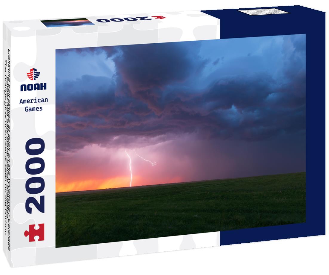 Noah Jigsaw Puzzle Lightning bolt strikes at dusk on the Wyoming / Colorado border with dark storm clouds overhead. The orange glow of sunset is seen on the horizon 2000 pieces