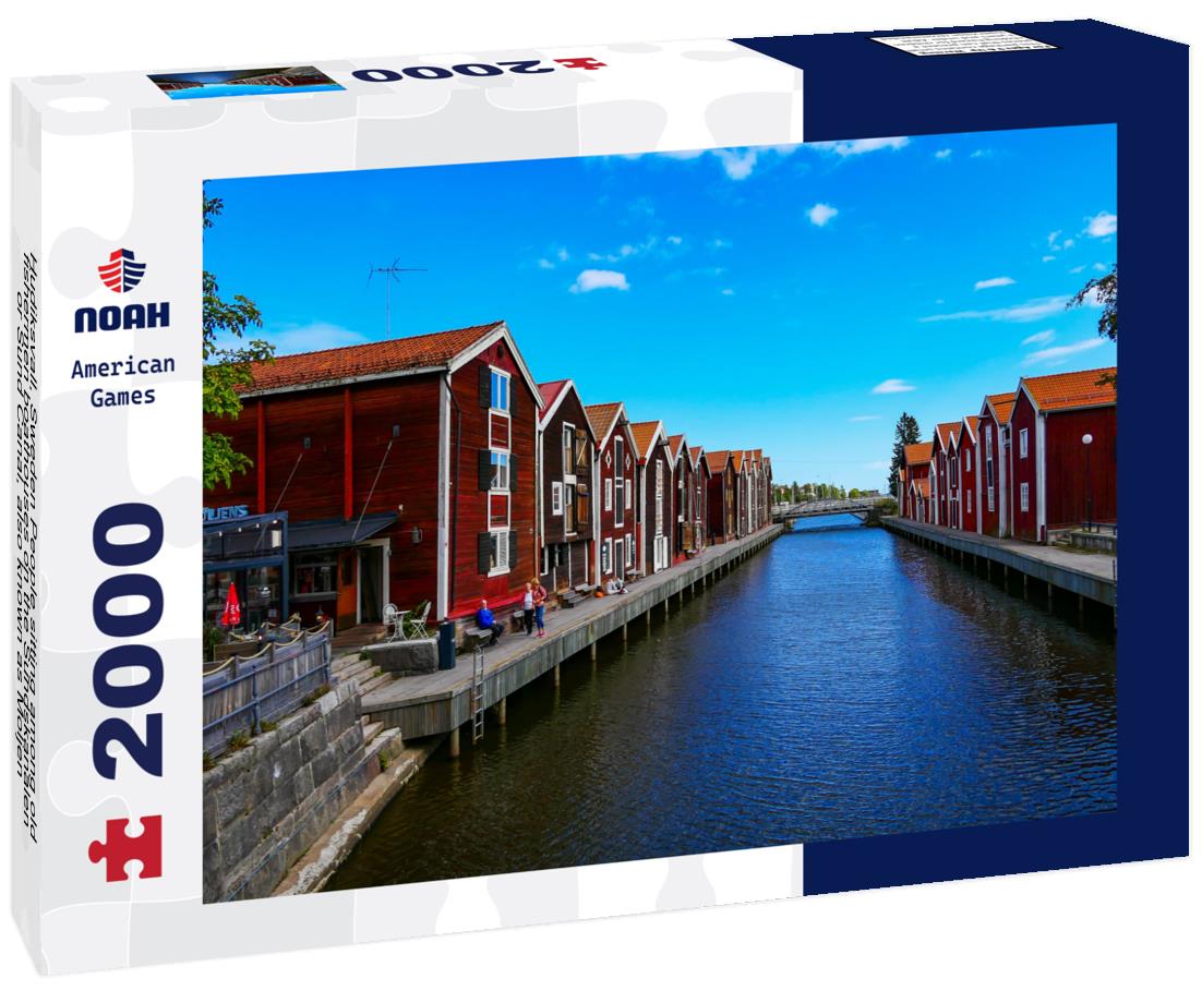 Noah Jigsaw Puzzle Hudiksvall, Sweden People sitting among old fishermen boathouses on the Sundskanalen, or Sund Canal, also known as Moljen 2000 pieces