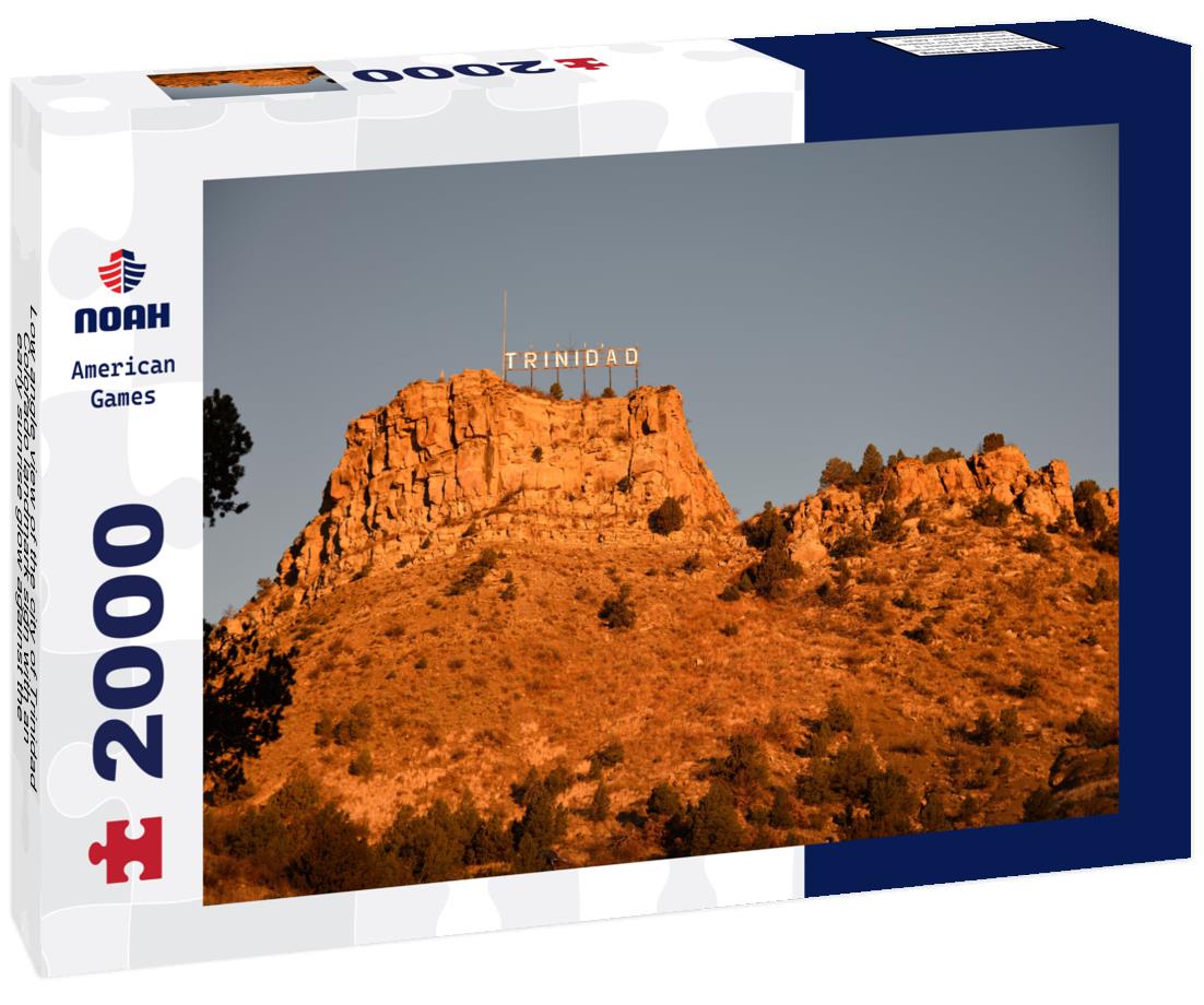 Low angle view of the city of Trinidad Colorado landmark sign with an early sunrise glow against the rocky butte and sky 2000pc Puzzle
