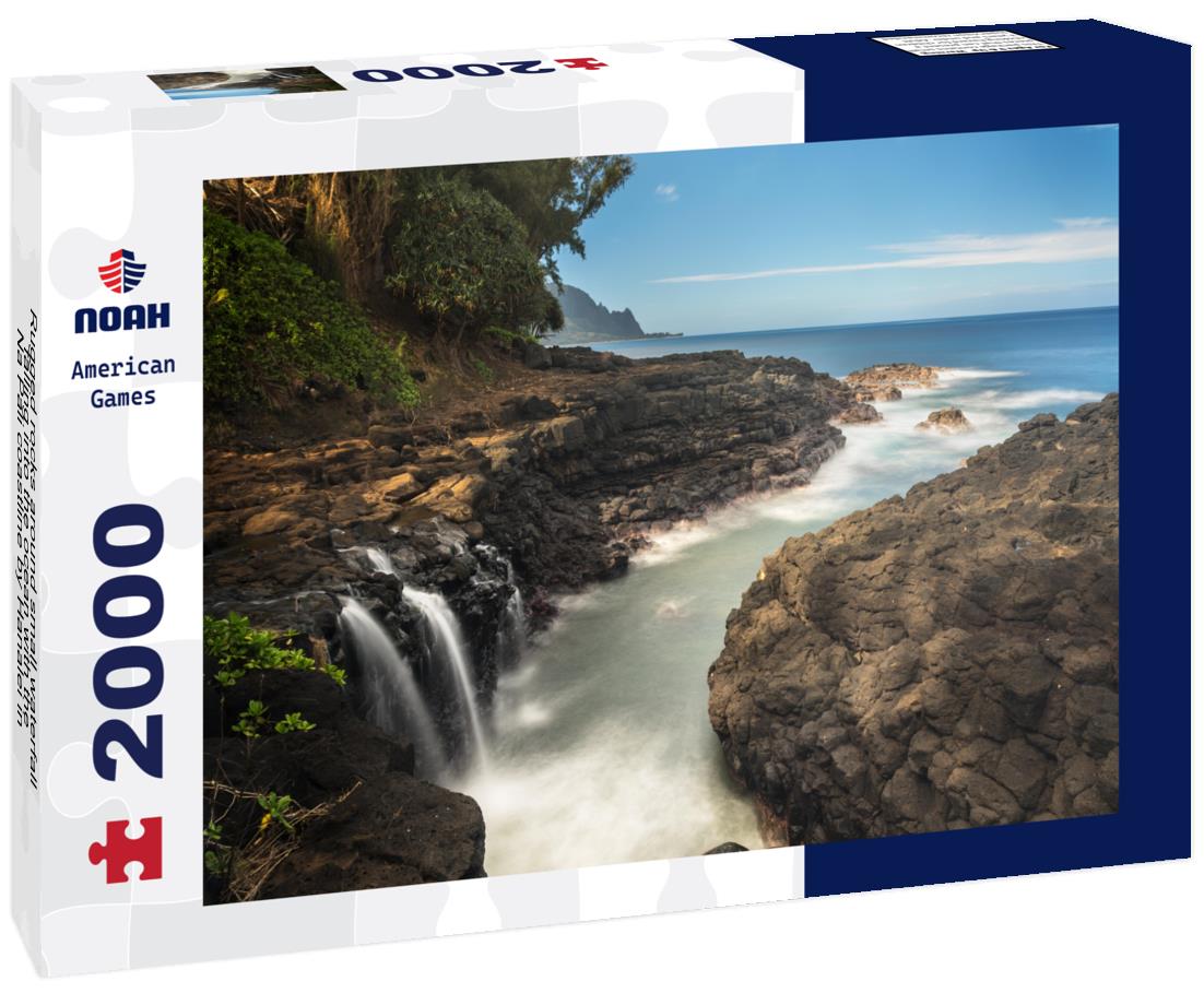 Noah Jigsaw Puzzle Rugged rocks around small waterfall falling into the ocean with the Na Pali coastline by Hanalei in the distance Hawaii 2000 pieces