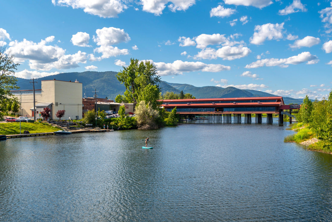 A young female paddleboarder on Sand Creek, a small river canal off Lake Pend Oreille in the town of Sandpoint, Idaho 2000pc Puzzle