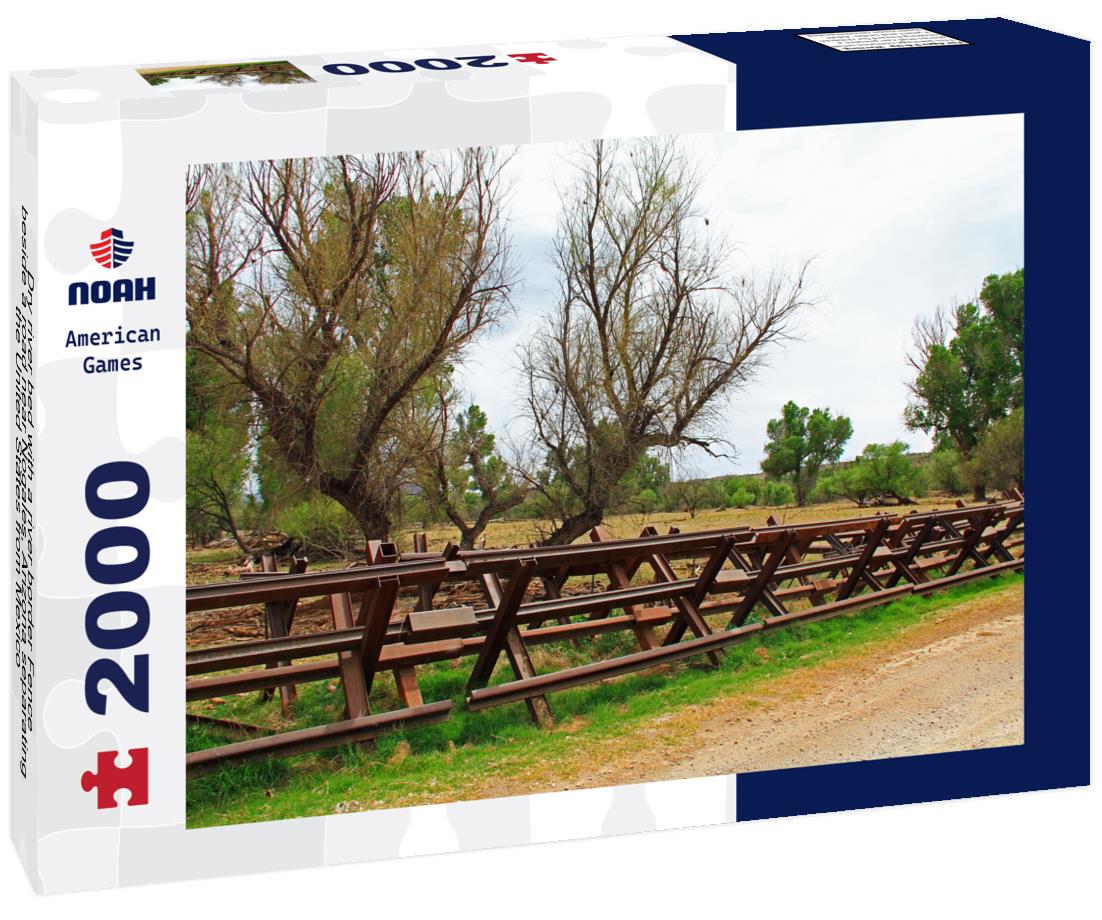 Dry river bed with a river border Fence beside a road near Nogales, Arizona separating the United States from Mexico 2000pc Puzzle