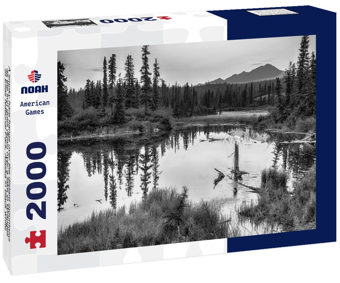 Noah Jigsaw Puzzle A smoky hare hangs over the distant mountains as the sun goes down over a lake in Wrangell-St Elias National Park, Alaska in black white 2000 pieces