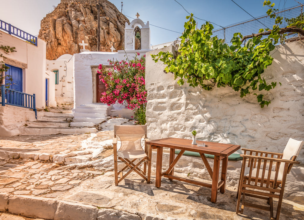 Traditional Greek street in town centre at sunset time, Amorgos Island, Greece